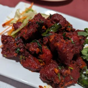 a plate of meat and vegetables