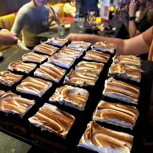 a table full of hot dogs