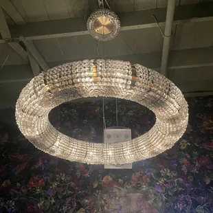 a circular chandelier with crystal beads