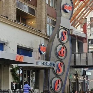 a large sign for a sports and social club