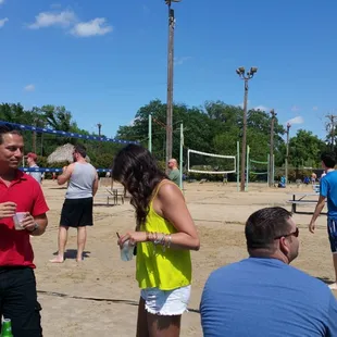 a group of people playing volleyball