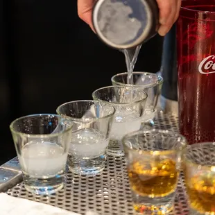  a bartender pouring a drink