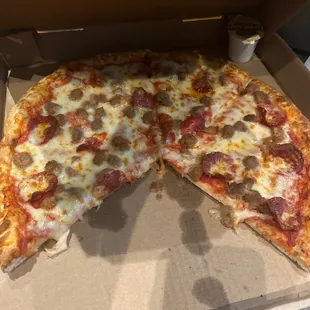 a half eaten pizza in a box