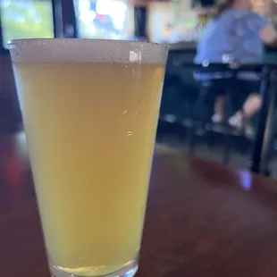 a glass of beer on a table