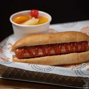 a hot dog with ketchup