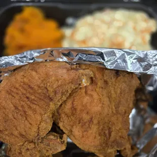 Porkchop dinner with potato salad and yams. So good!