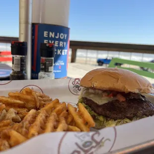 Burger with pepper jack cheese, salsa, and fries.