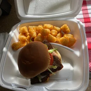 Ribeye sandwich w/ tater tots.
