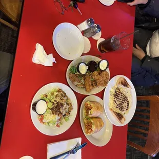 plates of food on a red table