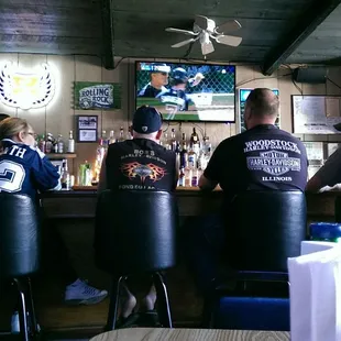 people sitting at the bar