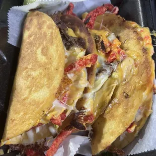 Birria Flamin with Cheese (Birria, onions, parsley, hot Cheetos, turbo sauce, nacho cheese)