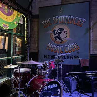 a drum set in front of a window
