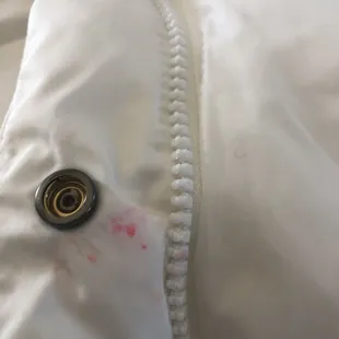 the zipper of a white jacket