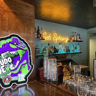 a bar with a neon sign