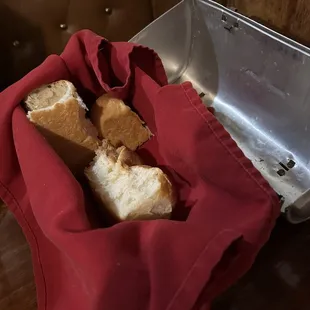 Complimentary bread brought out in a metal lunch box