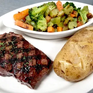 a plate of steak, potatoes, and broccoli