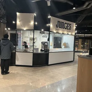 a man standing in front of a store
