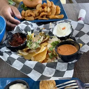 a plate of nachos and chips