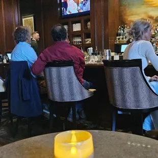 people sitting at the bar