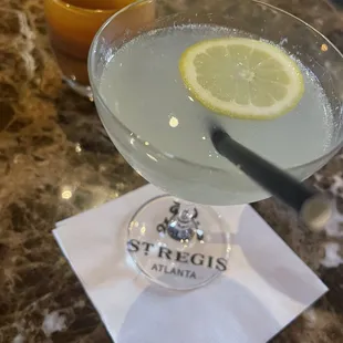 a lemon slice in a martini glass