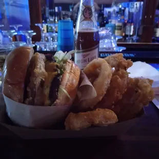 "the works" burger and a half order of onion rings