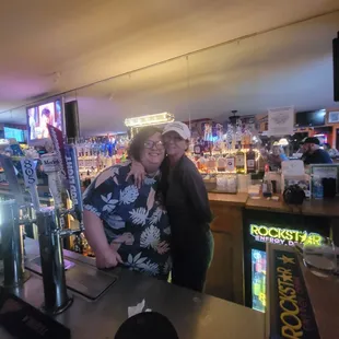 a man and a woman at a bar
