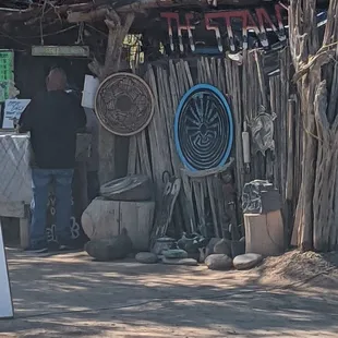 a man standing in front of a shack