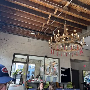 a restaurant with a chandelier hanging from the ceiling