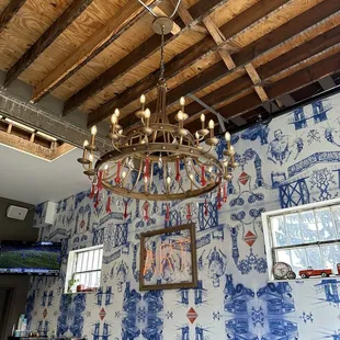 Artwork drawn by the owner and turned into wallpaper, chandelier