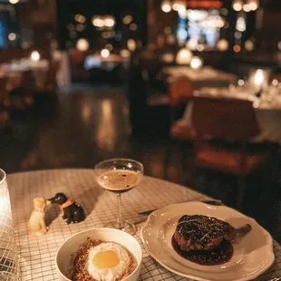 a plate of food and a glass of wine