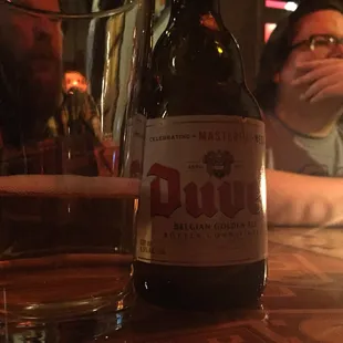 a bottle of beer on a table