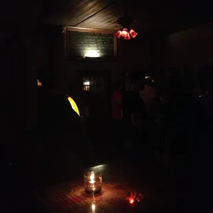 a candle lit up in the dark