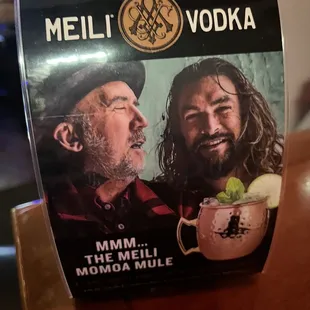 a picture of a man and a woman drinking a drink