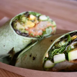 a burrito in a paper container