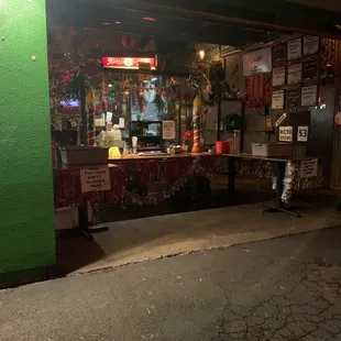 a restaurant with a green wall
