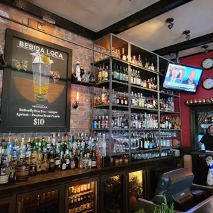 a bar with a brick wall