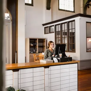 a woman sitting at a counter