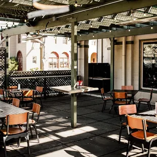 a patio with tables and chairs