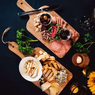 a platter of meat, cheese, and crackers