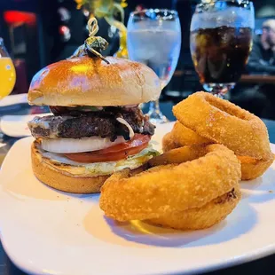 Standard Pub Burger w/bacon, avocado and a side of onion rings. So good!