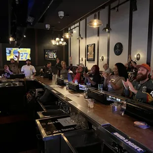 people sitting at the bar