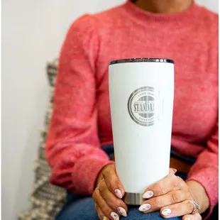 a woman holding a coffee mug