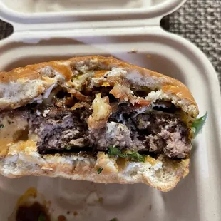 a sandwich in a styrofoam container