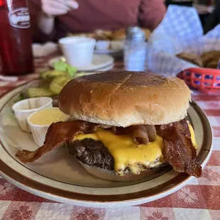 a burger with bacon and cheese