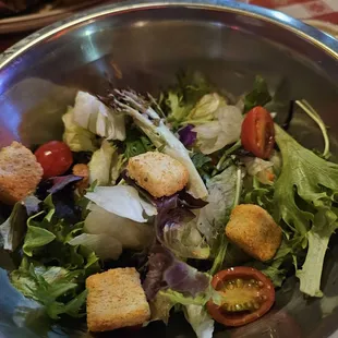 The salad, which comes with the meal. Waitress served it after our meals arrived - wanted to know if we still wanted it.
