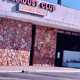 Front of bar. Don&apos;t park in the rear at night or even day or your car will be broken into.