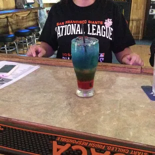 a woman sitting at a bar