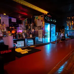 a bar with a laptop on the counter