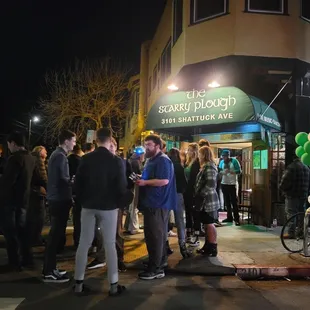 a group of people standing in front of a store