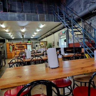 a dining area with tables and chairs